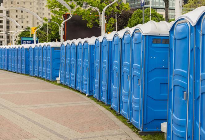 a row of portable restrooms set up for a special event, providing guests with a comfortable and sanitary option in Cockeysville